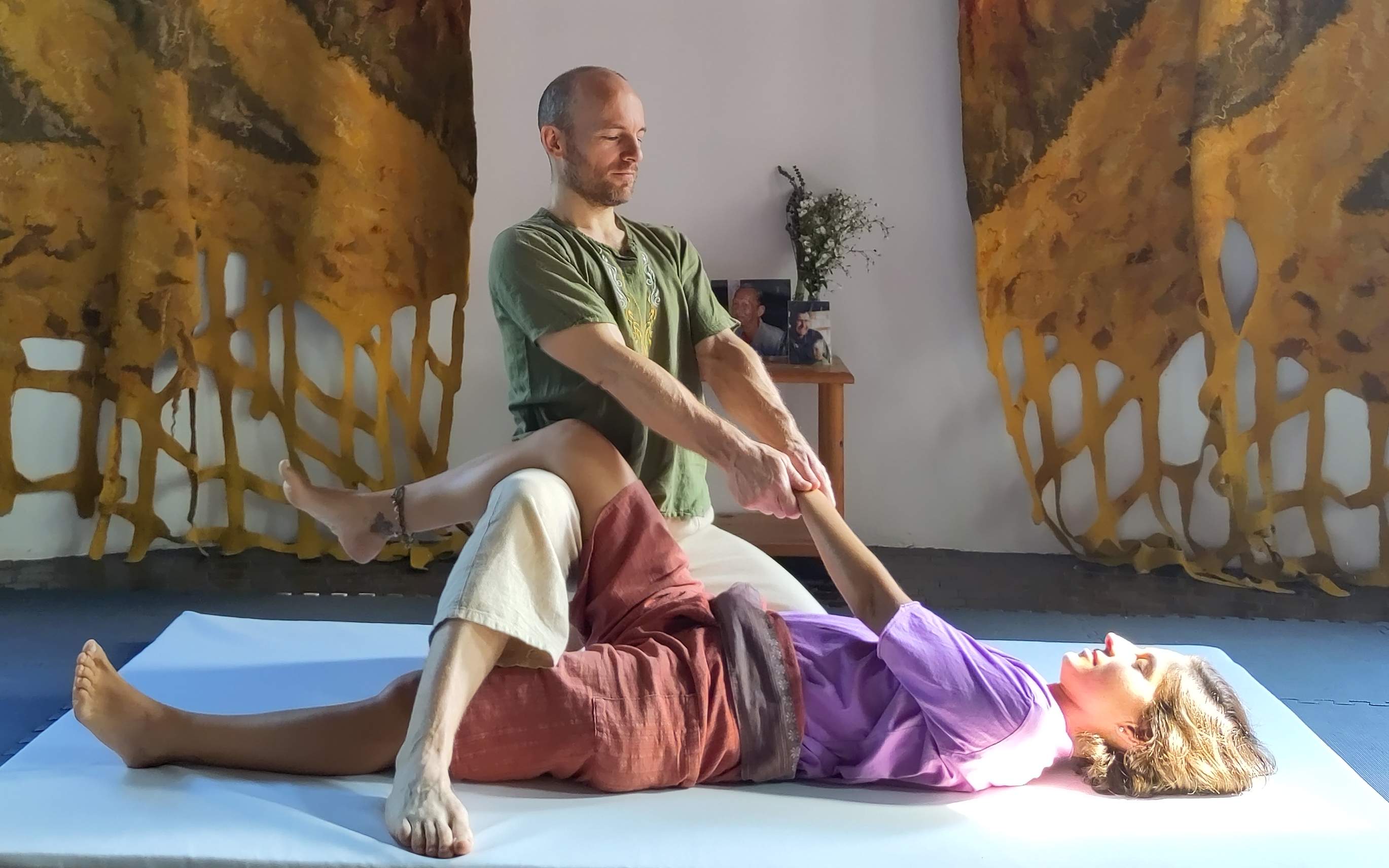 Justin demonstrating Thai massage techniques
